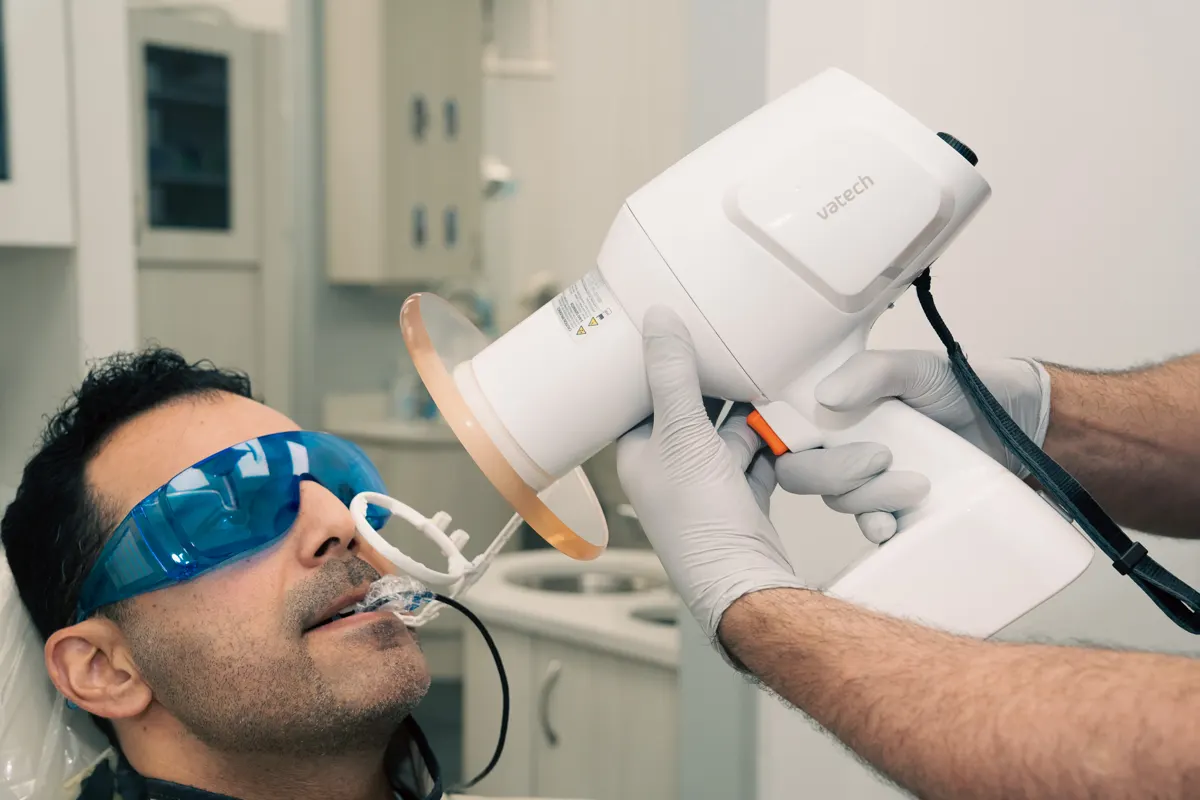 Dentist pointing to dental images at Omni Dental in Arlington Heights, IL
