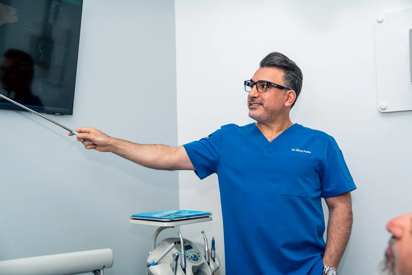 Dr. Bilus Poles explaining treatment in Arlington Heights, IL